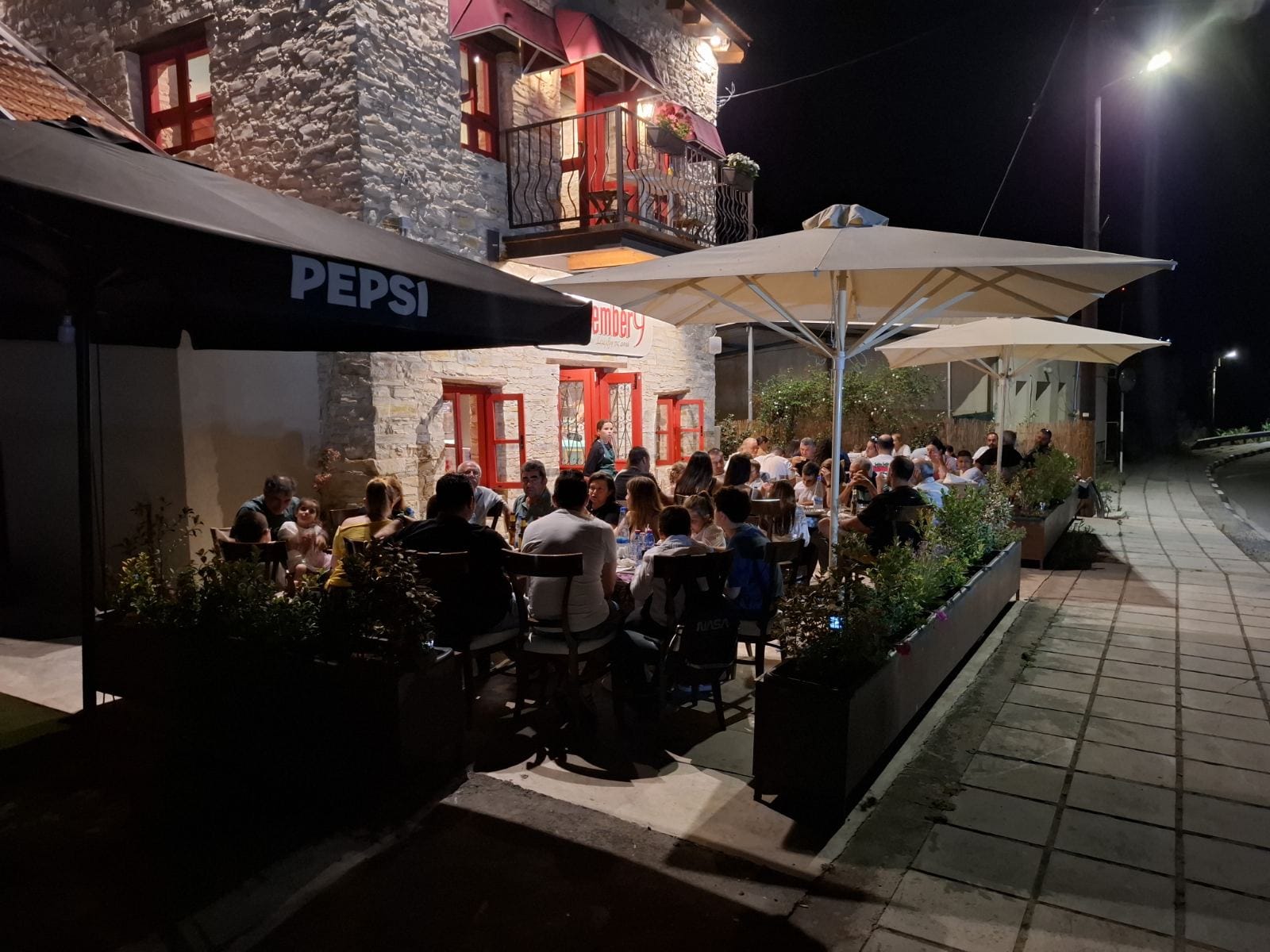 Guests dining on the terrace at December9 Agia Anna